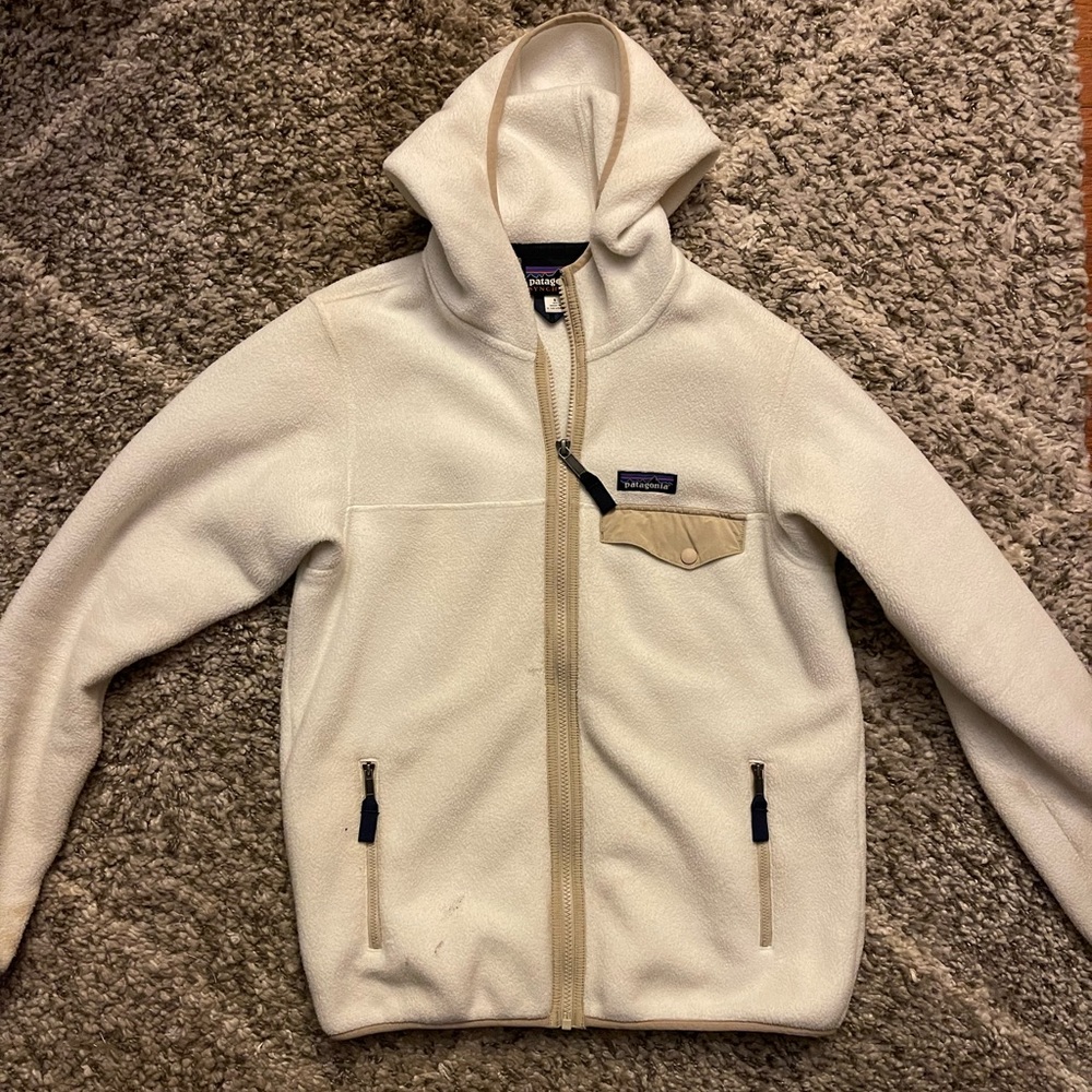 white and tan patagonia fleece zip up